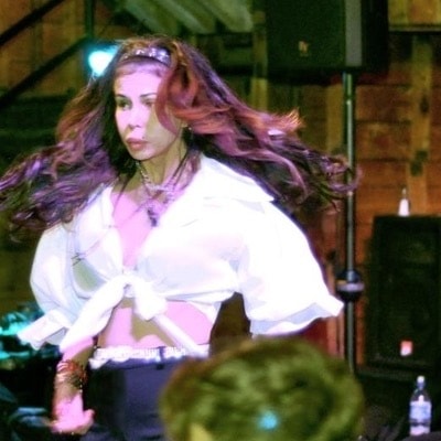 Reesi Rocca dancing on stage with flowing hair